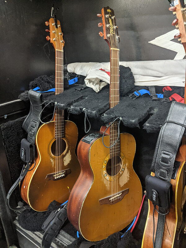 Rack of Kenny Chesney's Takamine guitars